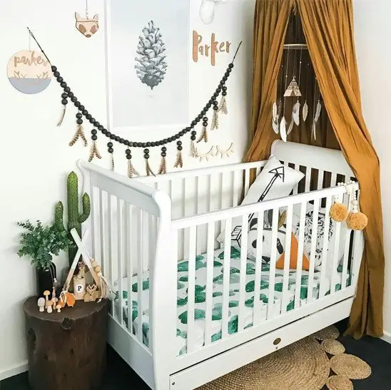 Boho woodland style nursery with cactus bedding 