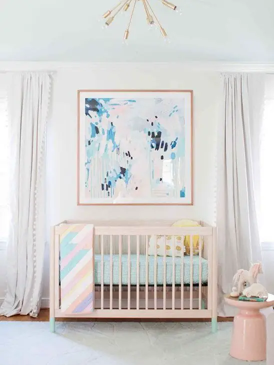 abstract painting over baby girl crib