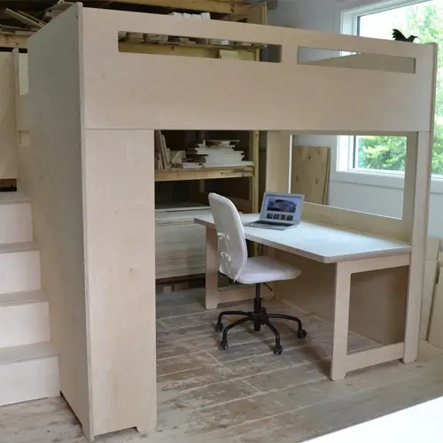 bunk beds with desk under them